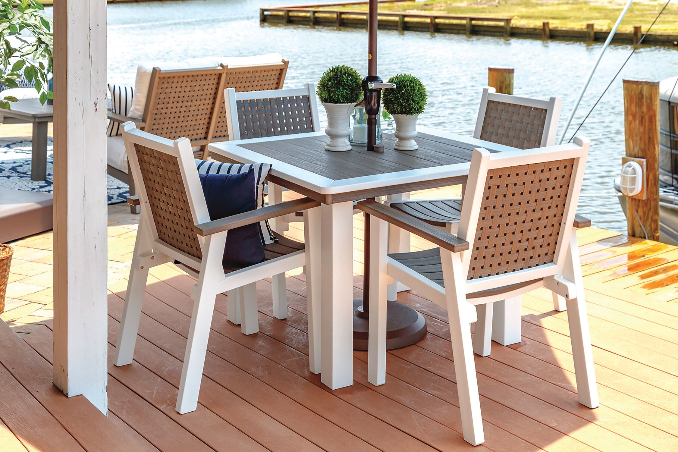 Marina Dining SetThe Comfort Craft Marina Dining Set chairs have woven fabric backs and durable poly-lumber construction for a lighter profile.