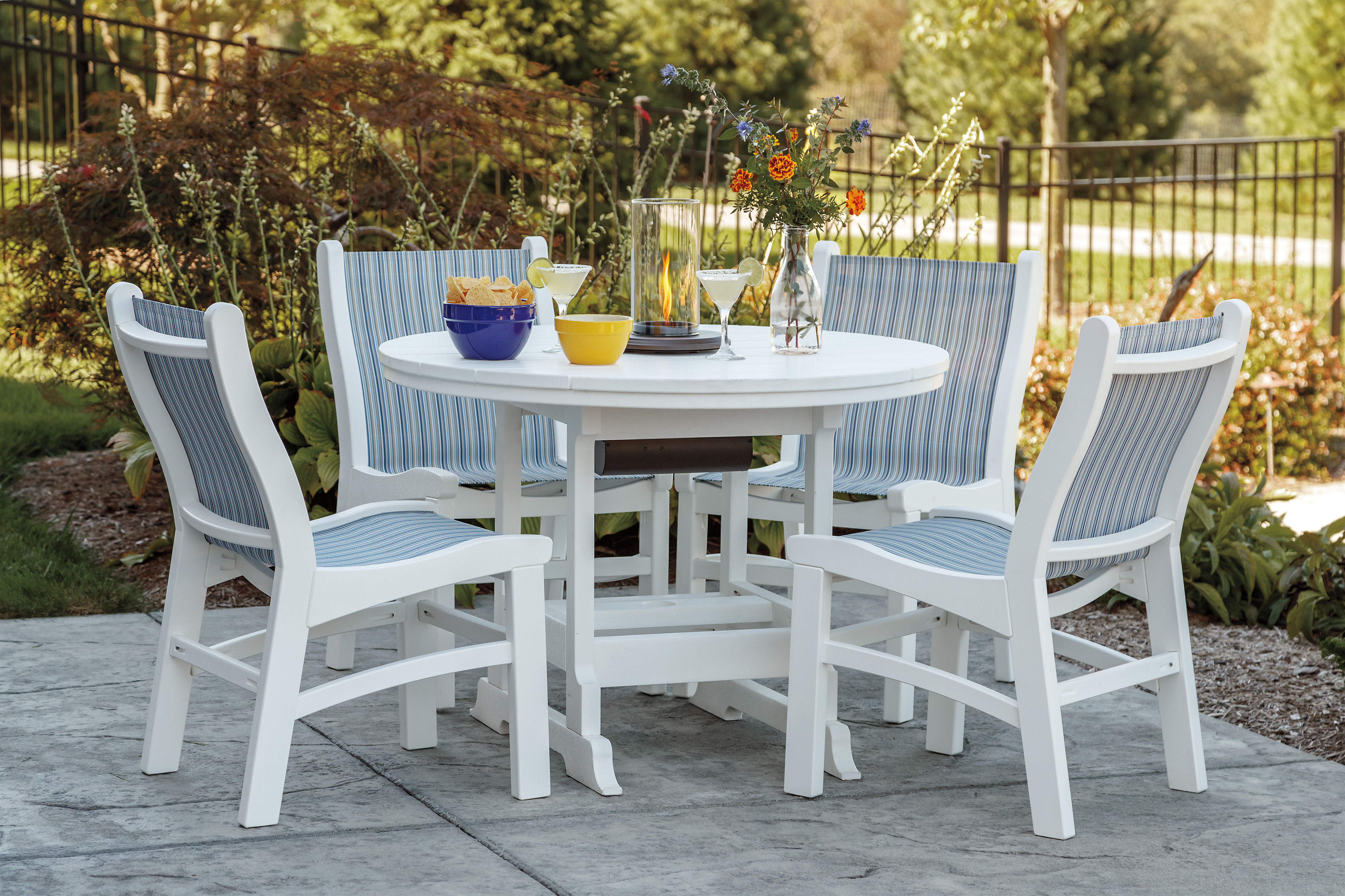 Sling Chairs come in a variety of fabric choices, shown here with Round Dining Table.